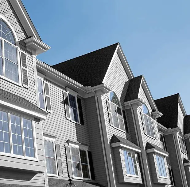 A row of houses with windows and doors.