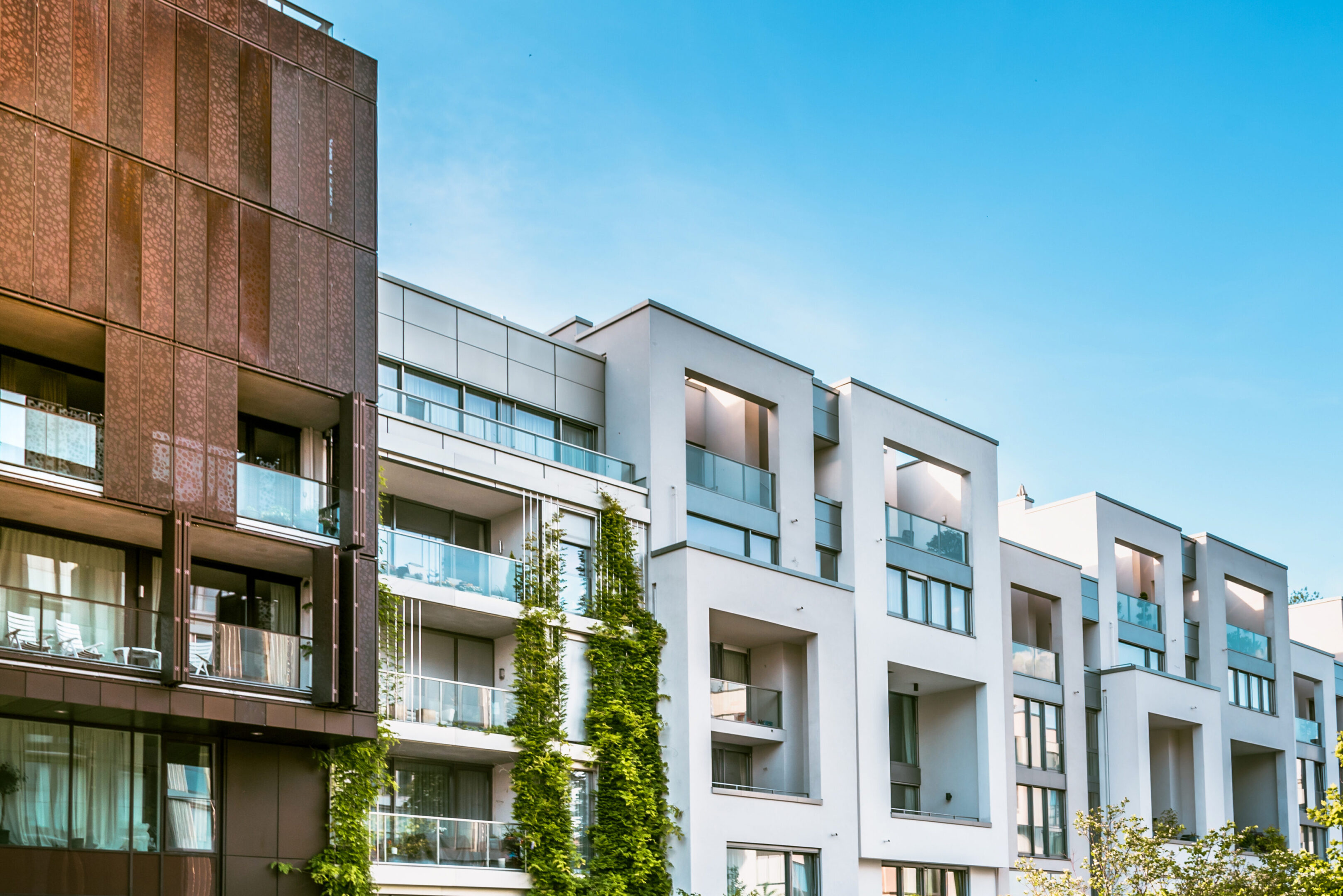 A row of buildings with balconies and windows.